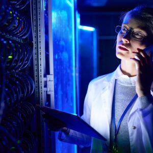 Female Scientist Speaking by Phone in Data Laboratory